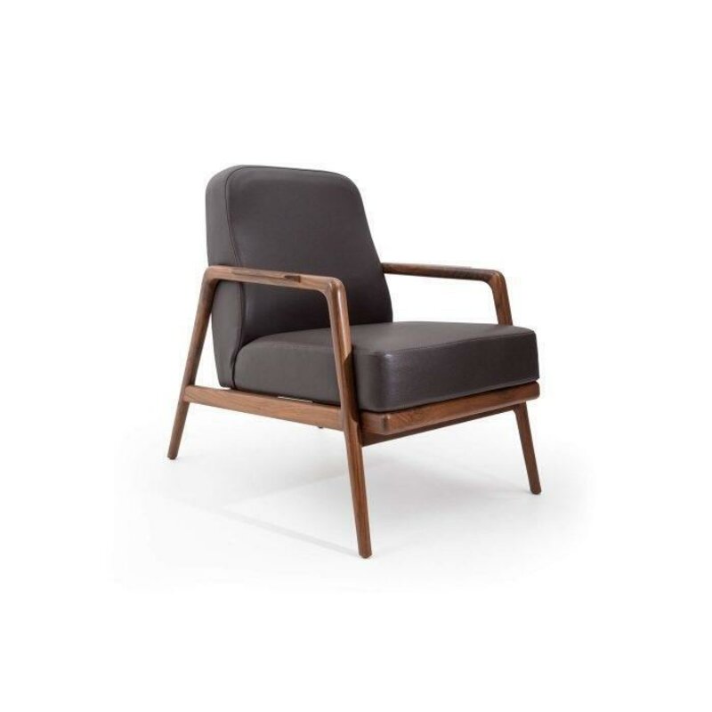 Design accent: new armchair in trendy colour with simple wooden frame