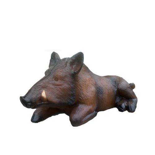 Decorative sculpture designed as lying wild boar figure in brown colored