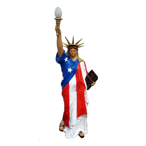 Decorative light sculpture designed as the statue of liberty under american flag style cloth