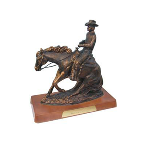 Decorative sculpture designed as bronze colored cowboy on a horse with a wooden stand 45cm