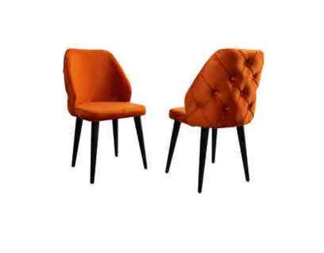 Upholstered wooden chair orange Chesterfield on black legs the dining room