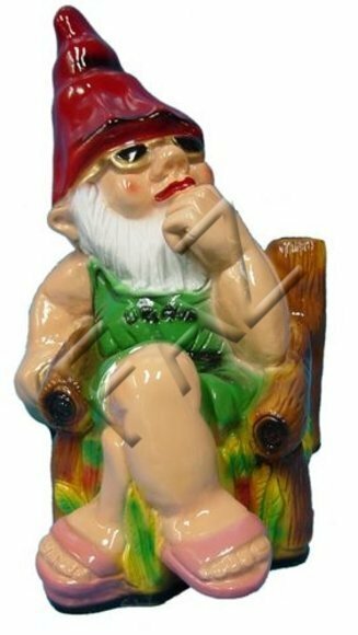 Decor figure designed as a resting dwarf sitting on an armchair 51cm