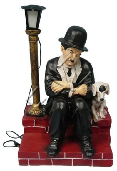 Decor light figure designed as a sad charlie chaplin with puppy sitting across a lamp