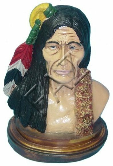 An old red indian bust decor figure on a round wooden stand 34cm