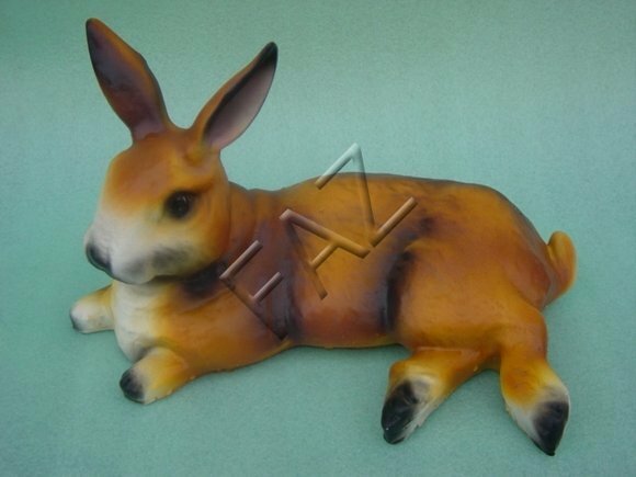 Decorative sculpture designed as resting lying motley brown bunny 19x34cm c400