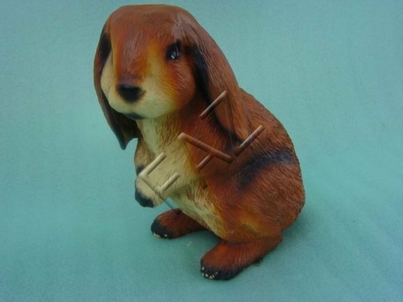 Motley brown beige colored bunny sculpture with lowered ears 27cm height