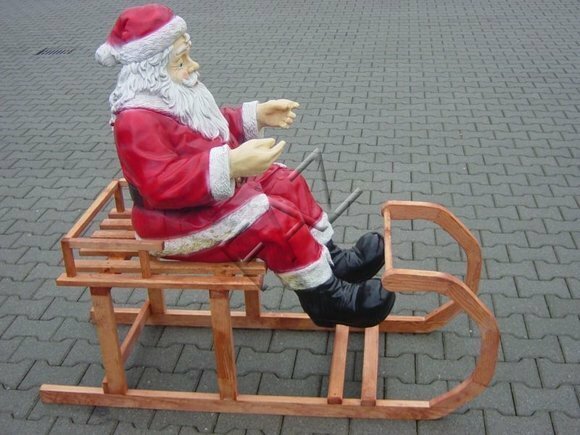 Christmas decorative sculpture designed as santa claus on a wooden sleigh 58x50x140cm