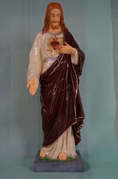 Decorative holy figure designed as standing gloss jesus with a heart