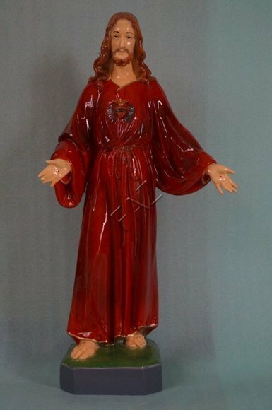 Decorative holy figure designed as gloss standing jesus in full red dress