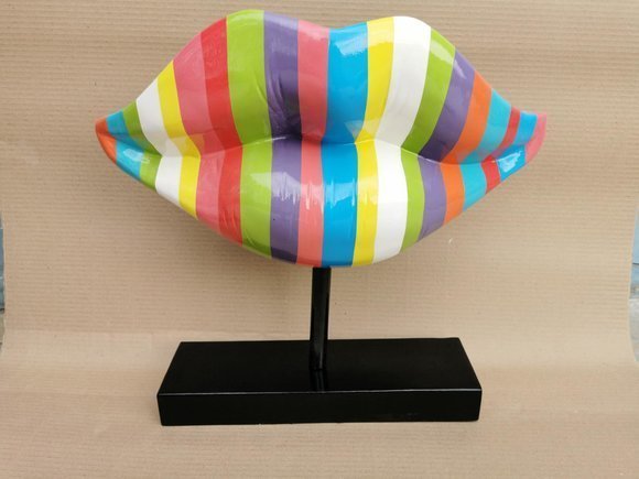 Abstract decorative sculpture designed as a lips in colorful stripes on a black stand 45cm