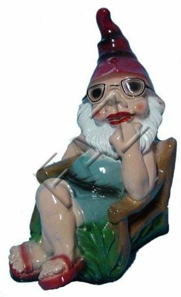 Garden decor figure designed as a colorful dwarf chilling on an armchair 26x24cm