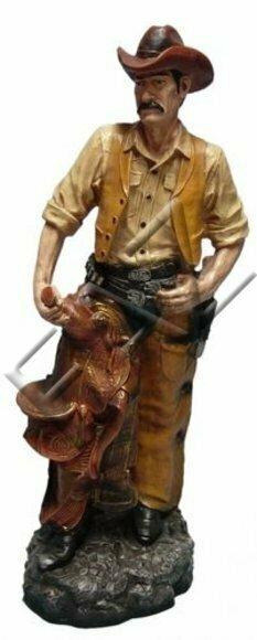 Decor figure of an original orange colored wild western cowboy on a stone 87cm