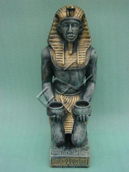 Grey golden colored deco figure of an ancient egyptian sitting servant holding two cups