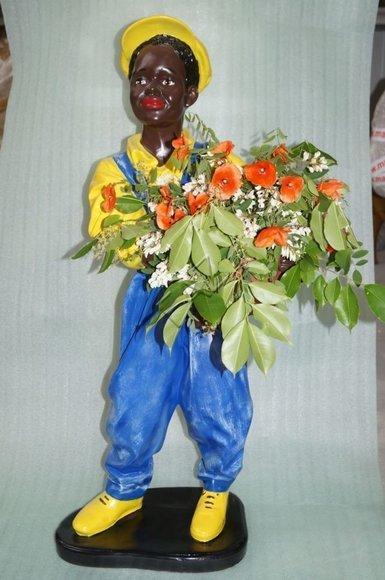 Deco figure designed as a boy gardener with a flower dressed in yellow blue suit 17x26cm