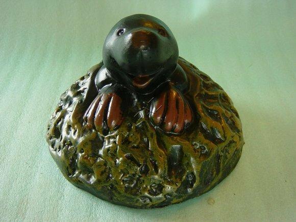 Happy black colored mole decorative sculpture looking from a ground 16cm height c238