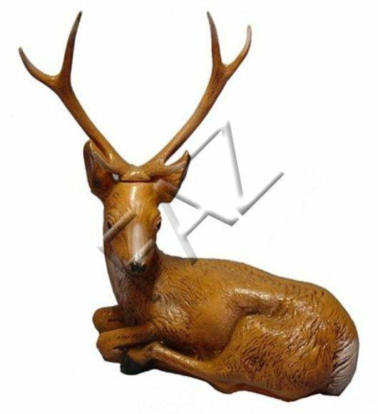 Decorative sculpture designed as resting light brown motley colored gloss deer with long horns 85x75cm