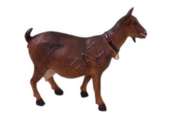 Decorative sculpture designed as gloss brown colored goat with a ring