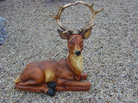 Decorative sculpture designed as an original colored motley brown beige lying deer with long horns 80x83cm c455