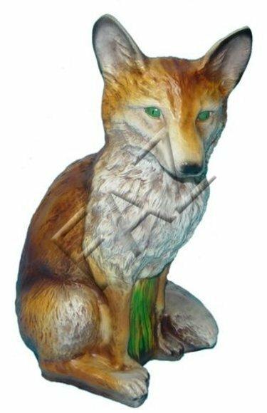 Decorative sculpture designed as dark orange colored motley sitting fox with green eyes