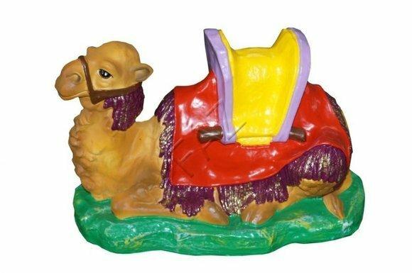 Colorful decorative garden sculpture designed as a resting camel on grass 24x36cm