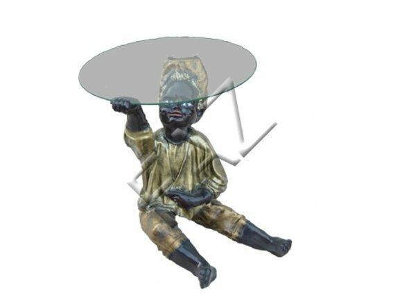 Glass coffee table with a decorative gloss black colored boy figure 60cm