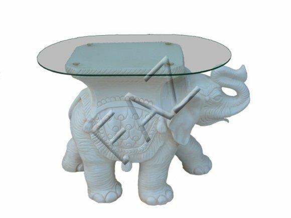 Oval glass coffee table with an white colored elephant figure 45cm