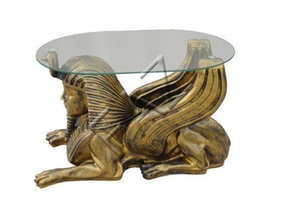 Oval glass coffee table with an ancient golden sphinx sculpture 45cm