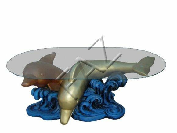 Oval glass coffee table with two golden dolphins on a wave sculpture 44cm