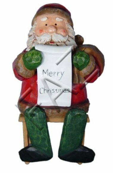 Christmas decorative figure designed as sitting santa claus with a merry christmas tablet 35cm