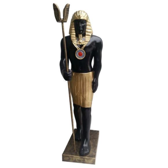 Ancient egyptian decorative sculpture designed as black golden colored guardian figure 120cm