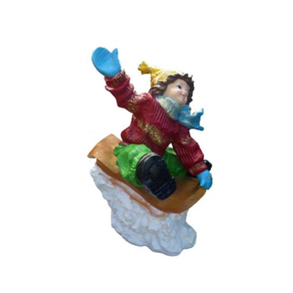 Decorative sculpture designed as a christmas figure boy in a sled 51cm